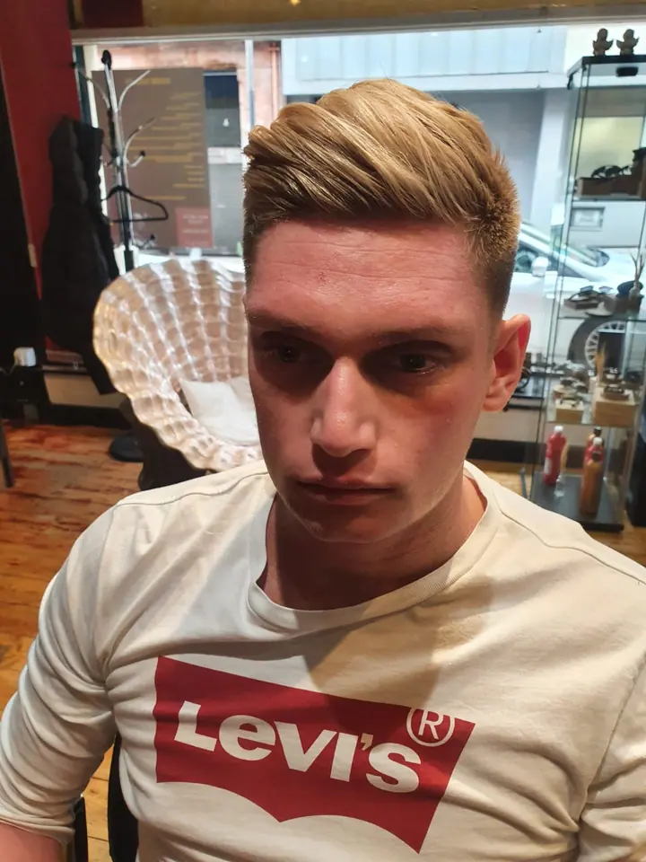 Blonde side-parted quiff, front view