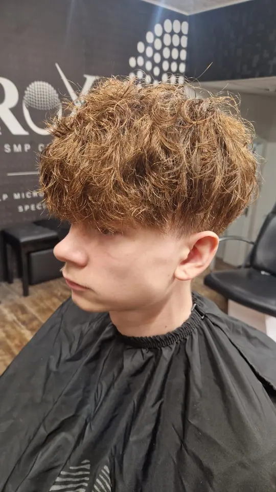 Copper curly crop with a taper, side view